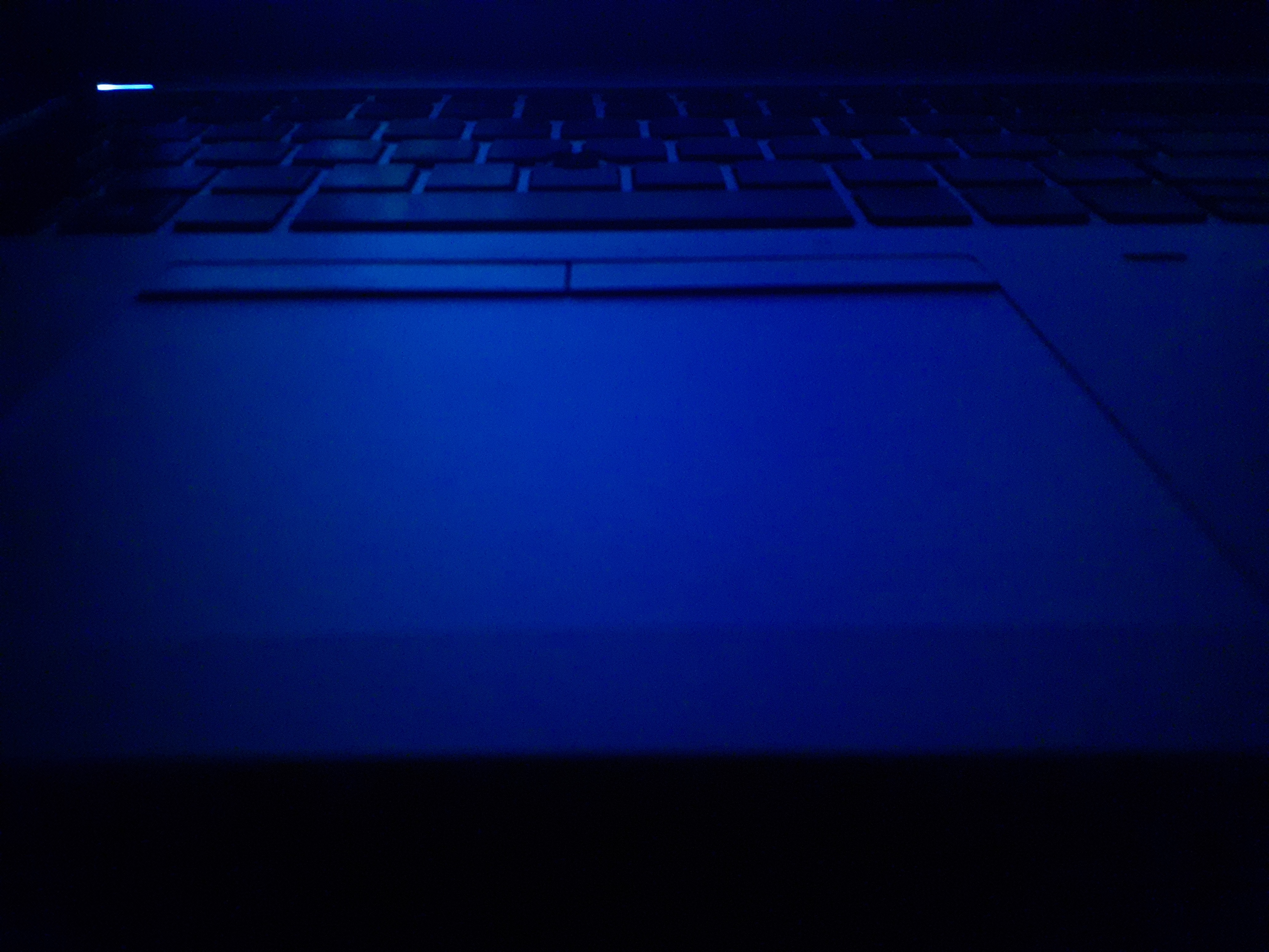 Laptop lit by blue light